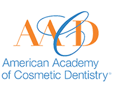 The image shows a logo with text that reads  AMERICAN ACADEMY OF COMETIC DENTISTRY  and includes an acronym  AACD.