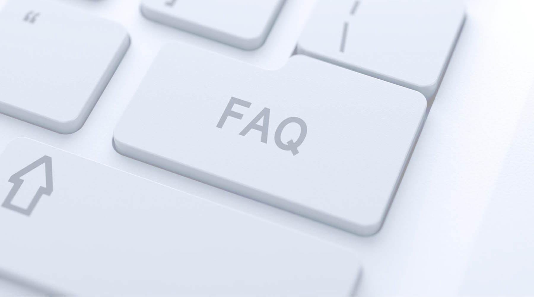 The image shows a close-up view of a computer keyboard with a white key labeled F10 prominently displayed, and a blurred background featuring a portion of a keyboard with the word FAQ visible on one of its keys, suggesting that the image is related to a frequently asked questions section.