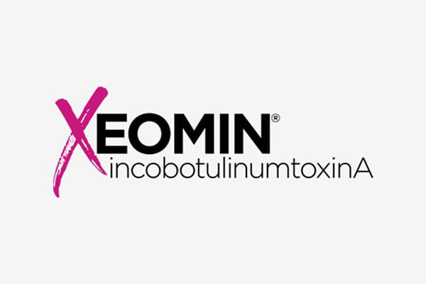 The image displays a logo with text that reads  XEOMIN  prominently above a stylized graphic, followed by additional text  INKCOBULIN NUMEROTIN A.  The background of the image is white, and there is a watermark or logo at the bottom left corner.